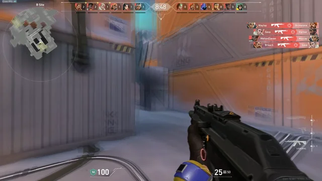 A tactical first person view holding an assault rifle aimed at an angle during a competitive match